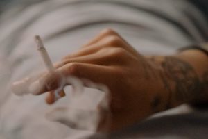 hand holding pre-roll